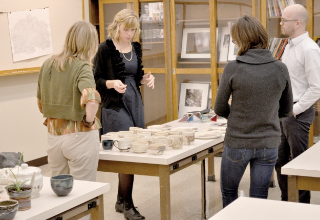 Olivia Bain, who is pursuing double emphases in Ceramics and Sculpture, presenting her work to professors Anna Arnar, Megan Duda, and Patrick Vincent. Fall 2014.